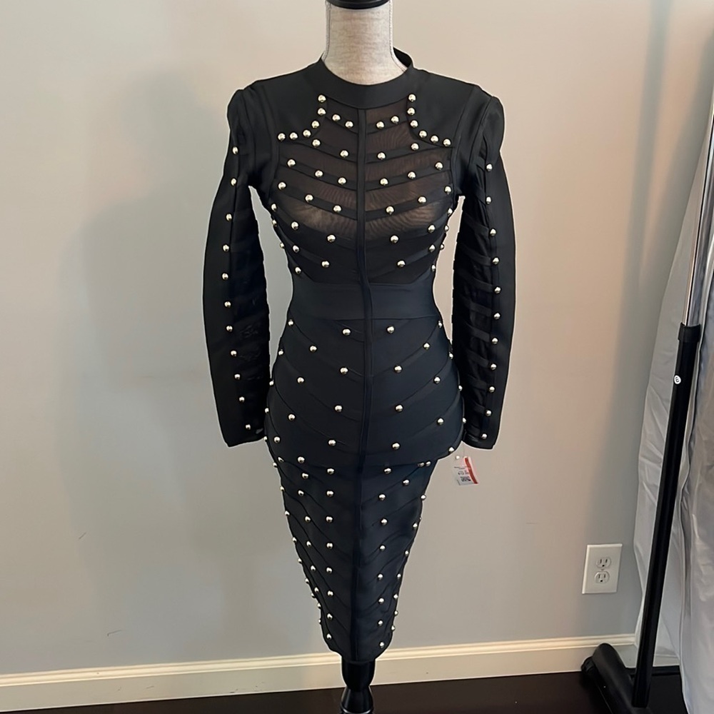 He go black bandaid dress size small.  Gold studs though out.  Sheer upper.